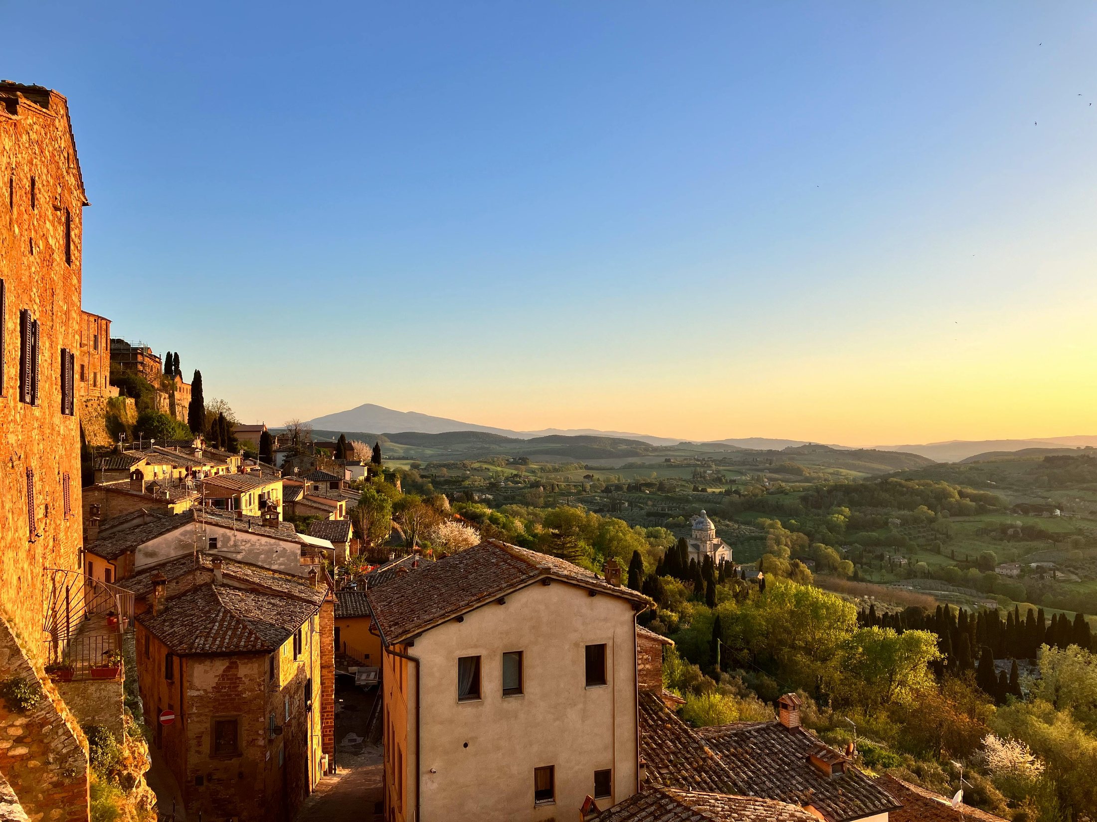 Tuscan countryside seen from a hilltown at sunset