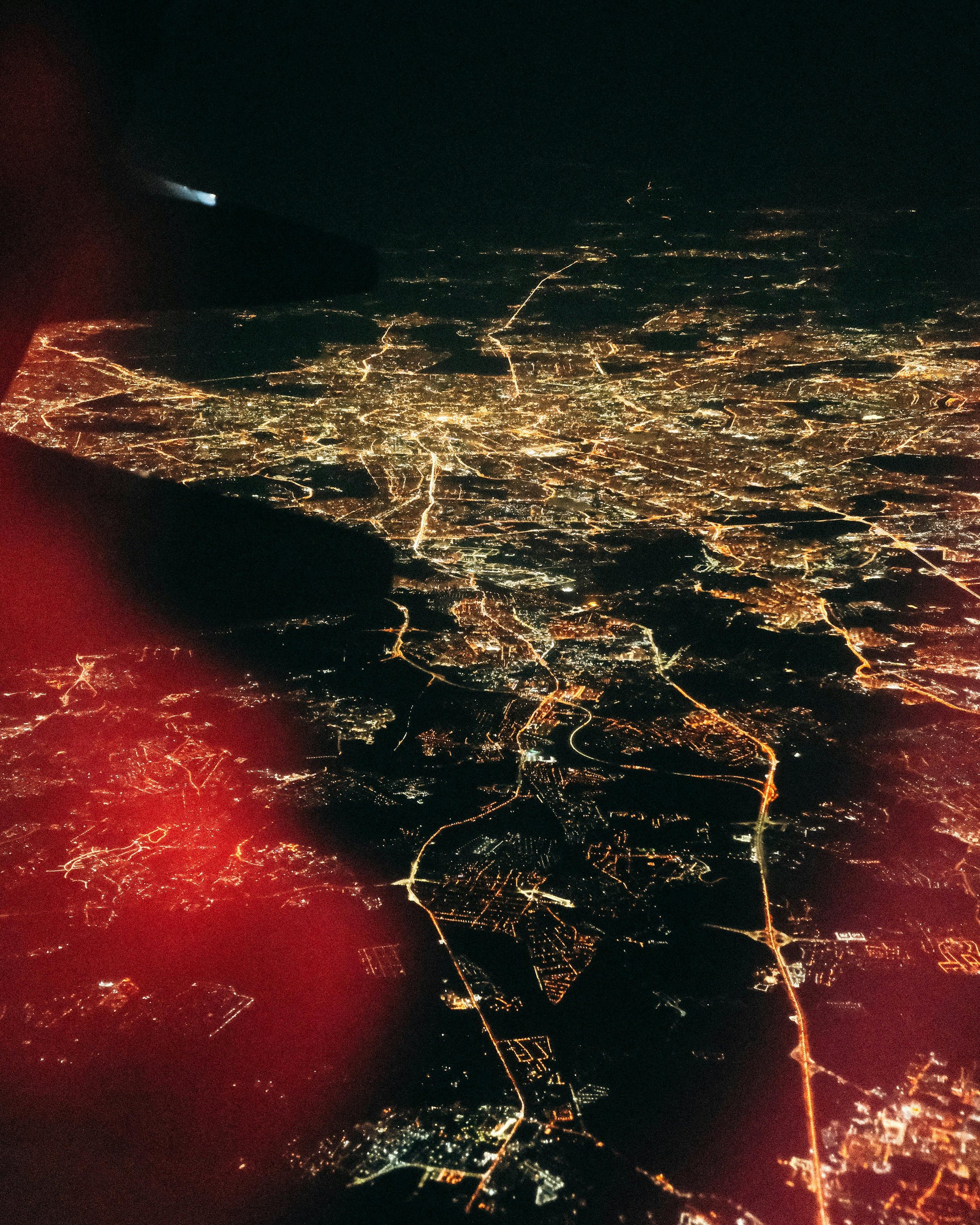 City lights seen from an airplane window at night